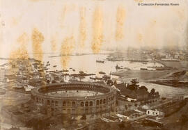 Málaga, la plaza de toros y el puerto con las obras de relleno en marcha. Autor desconocido.