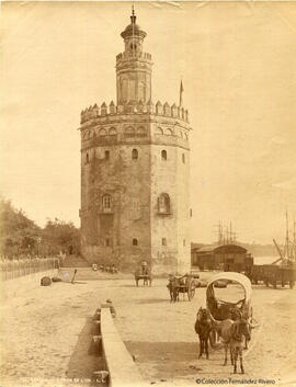 Sevilla, la Torre del oro junto al río Guadalquivir y varios carruajes. Léon et Lévy.