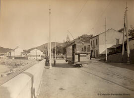 Málaga, barriada de Bellavista con un tranvía en primer plano y el castillo de Santa Catalina al fondo, M. Osuna