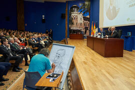 Idígoras dibuja a Pablo Hernández de Cos durante su conferencia en la Facultad de Ciencias Económicas y Empresariales de la Universidad de Málaga. Paraninfo. Octubre de 2022