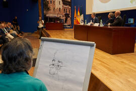 Idígoras dibuja a Pablo Hernández de Cos durante su conferencia en la Facultad de Ciencias Económicas y Empresariales de la Universidad de Málaga. Paraninfo. Octubre de 2022